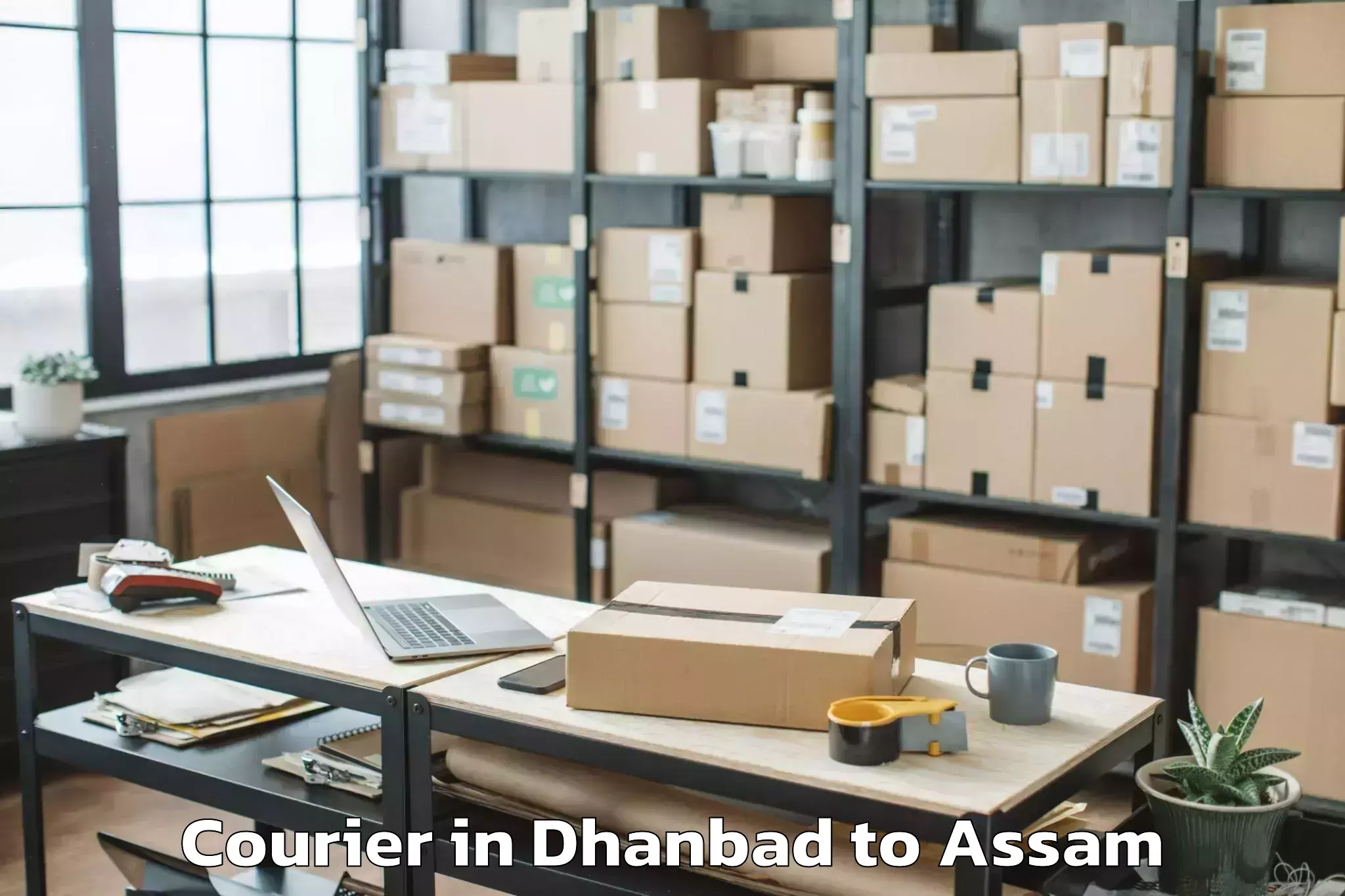 Easy Dhanbad to Darangamela Courier Booking